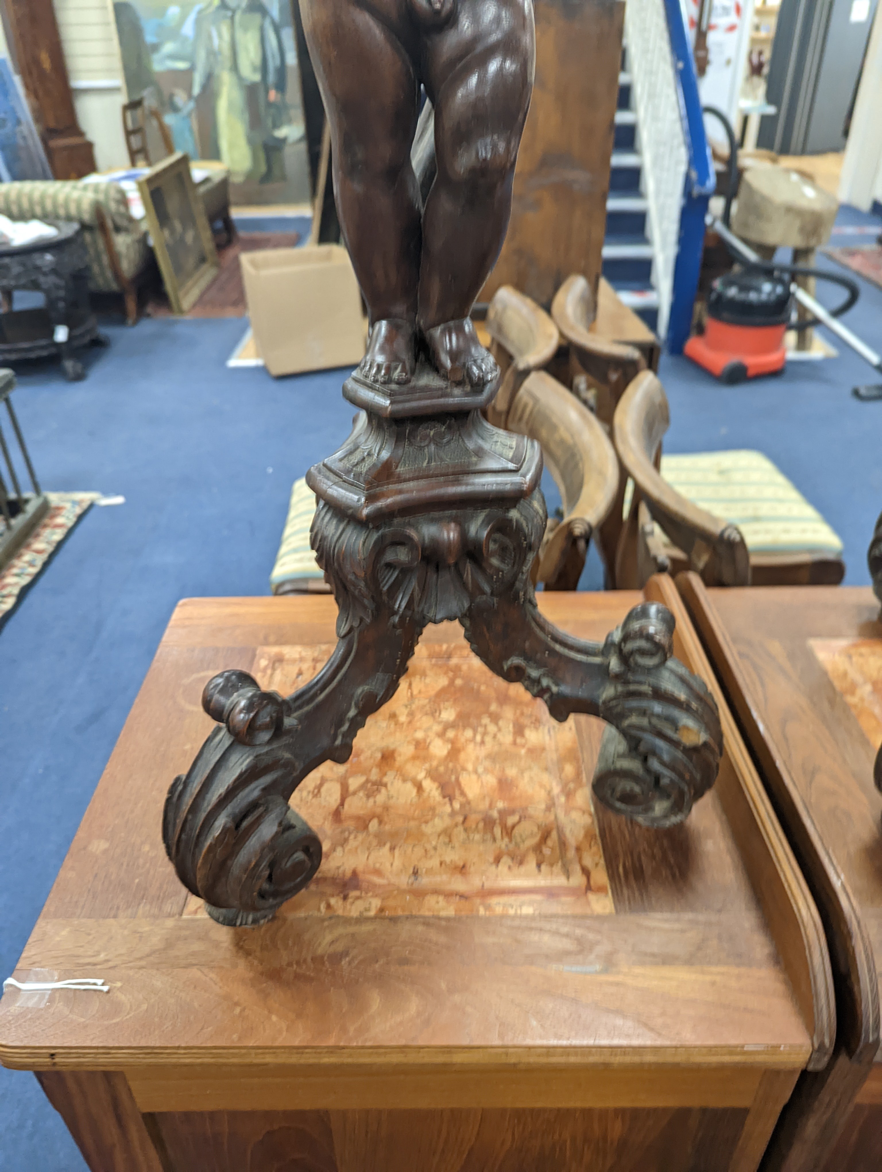 A pair of 18th century style Italian carved walnut figural torcheres with cherub stems, height 96cm